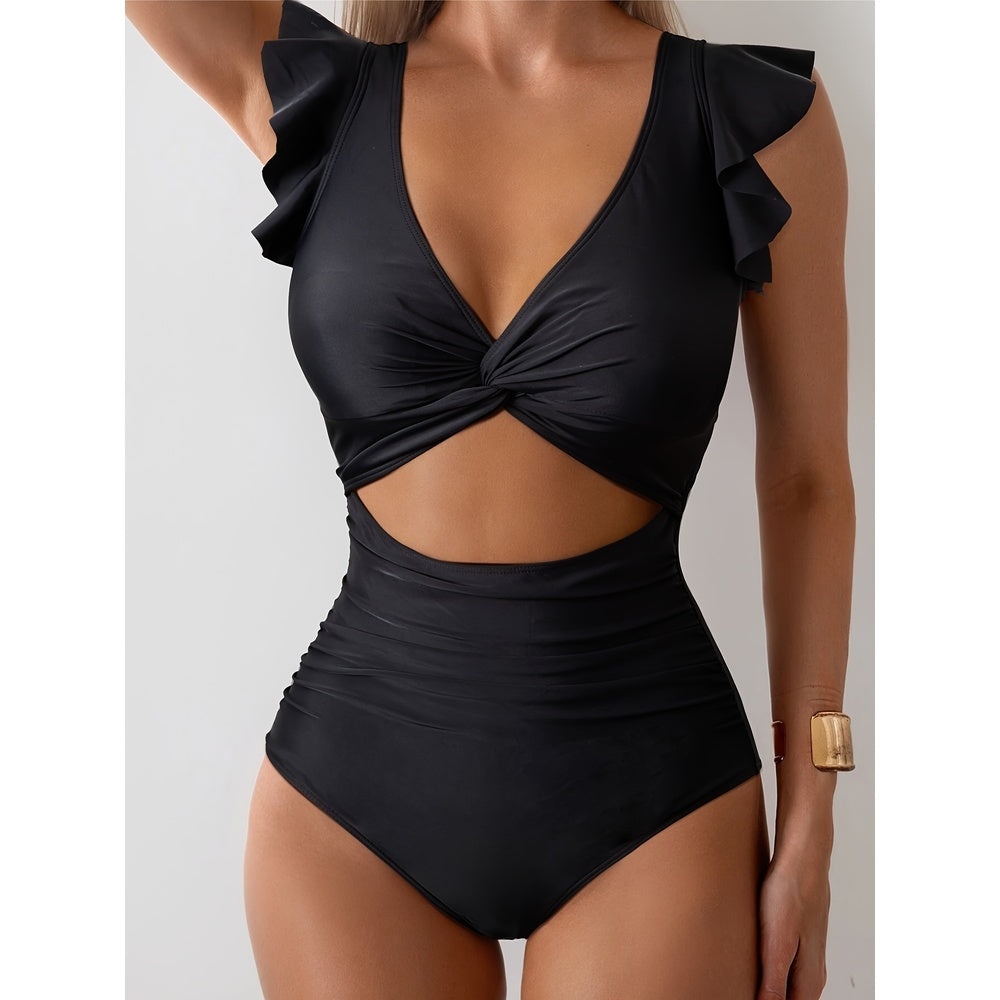Black swimsuit with ruffled shoulders on a neutral background